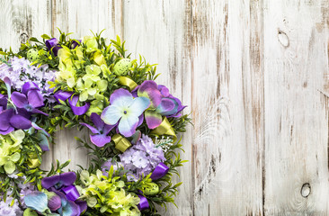 Easter decoration from easter eggs, easter boxwood and flowers.