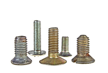 Various old screws on a white background