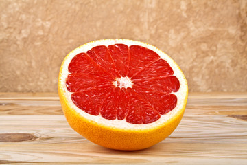 Grapefruit slice on wooden background