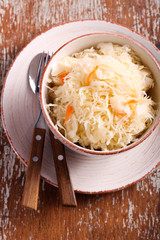 Pickled cabbage with carrots in a bowl