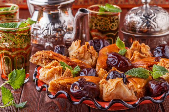 Moroccan mint tea in the traditional glasses with sweets.