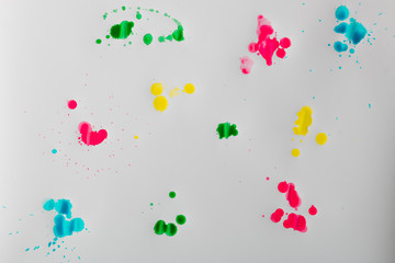 Vibrant dye stains on white paper