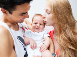 An image of a happy family of three
