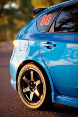 Front side view of blue sport car