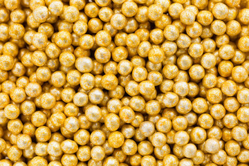 Golden dragee balls background