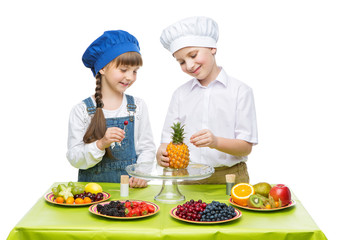 Children making fruit snacks
