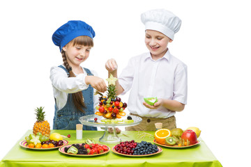 Children making fruit snacks