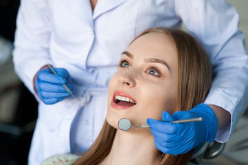 Dentist examining a patient's teeth in the dentist.