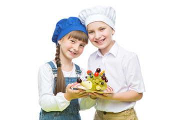 Children holding hedgehog shape fruit snack