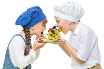Children holding hedgehog shape fruit snack