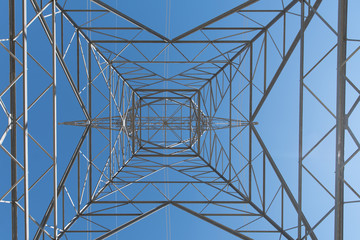 Electricity Tower In California. Inside shot of a electricity tower in California carrying sustainable power from windmill generation of sustainable energy.