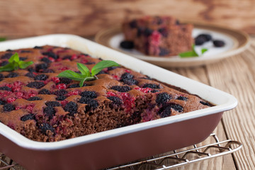 Gingerbread cake with mulberries and red currants