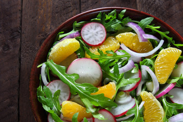 Salad with arugula, radish,red onion and tangerine