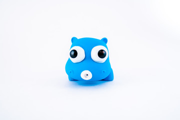 Blue isolated squeeze bath toy, hippo on white background. 
