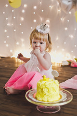 A little girl sitting in front of a sweet cake 5377.