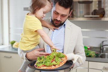 Naklejka premium happy father and his child have fun during lunch