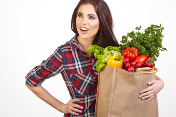 Young woman with a grocery shopping bag. Isolated on white backg