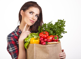 Young woman with a grocery shopping bag. Isolated on white backg