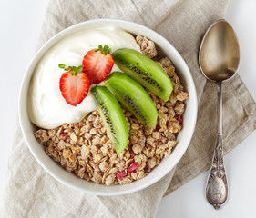 Bowl of granola with yogurt and fresh fruit