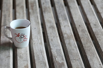 a Cup of coffee on wooden table