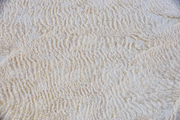 White wall on travertines, textured background at Pamukkale reserve