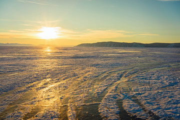 Lake Baikal at the source of the river Angara. Magical sunset. Russia