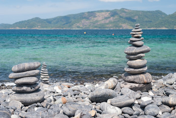 Stack of pebbles on beach, Koh Hin Ngam is a small Island near Koh Lipe in Thailand