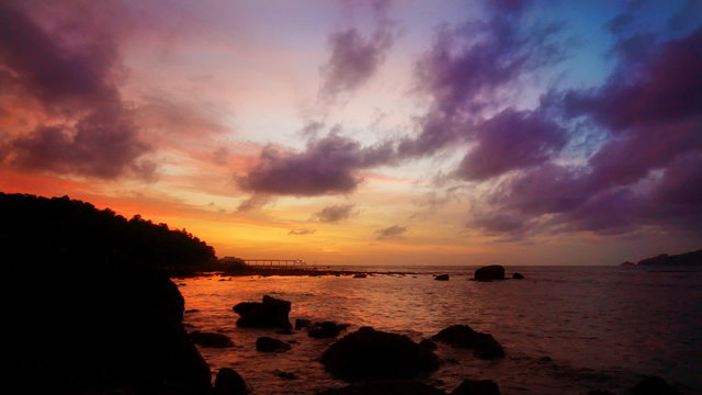 Romantic sunset at Indian ocean coast. Shot on Patong beach, Phuket, Thailand. FullHD 1080p.
