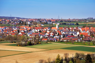 Fototapeta na wymiar Herrenberg Panorama. Red roofs of old city on distance. Baden-Wurttemberg, Germany