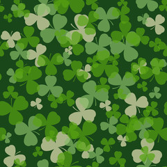 Vector St Patrick's day seamless pattern. Green and white clover leaves on dark background. Irish design for card, invitation or greeting, textile, website, brochures and booklets
