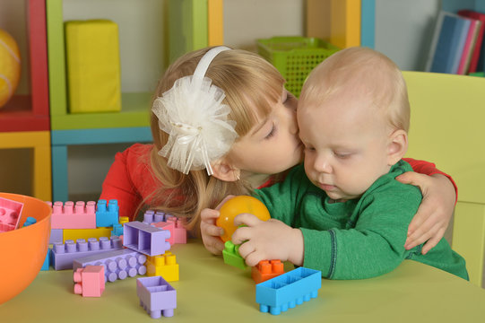 boy and  girl of playing with cubes