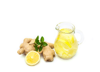 Ginger tea with lemon, ginger root and mint on white background