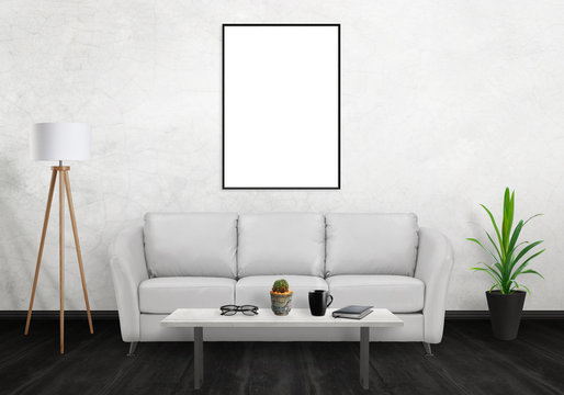 Isolated vertical art frame on white wall. Sofa, lamp, plant, glasses, book, coffee on table in room interior. 