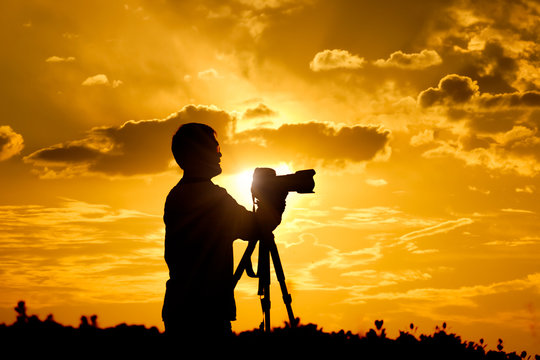 photographer take photo in sunset