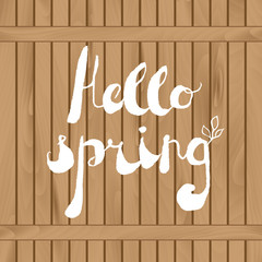 Spring season welcoming, season greetings. Handwritten text "Hello spring" on wooden fence. Modern vector card template. Layered for easy editing.
