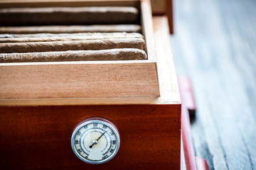 Close view on cedar wood humidor with cigars