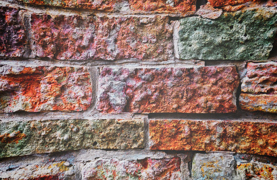 The old brick and stone wall.  Apply color and lighting effects. Vignetting. Matting. Artistic technique.
