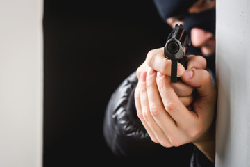 Aiming murderer with a gun