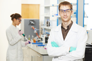 scientific researchers making experiment in laboratory