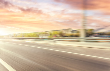 Car driving on road, motion blur