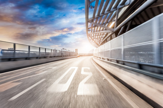 Car Driving On Road In City Background, Motion Blur