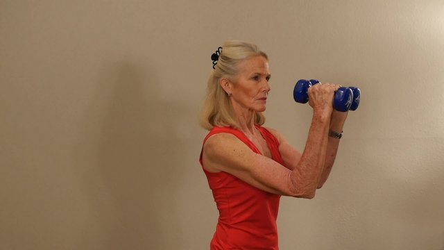 An attractive mature woman doing her workout