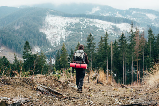 caucasian male hiking in mountains