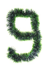 numeral from green Christmas tree decorations on a white background