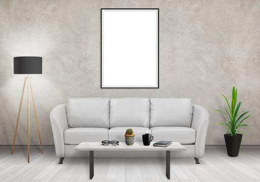 Isolated vertical art frame on white wall. Sofa, lamp, plant, glasses, book, coffee on table in room interior. 