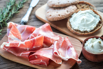 Slices of jamon and sandwich with cream cheese