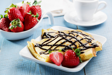 pancakes with strawberries and chocolate breakfast