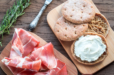 Slices of jamon and sandwich with cream cheese