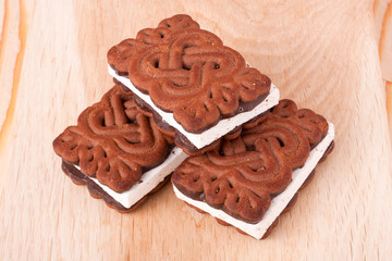 coockies with zephyr layer on wooden background