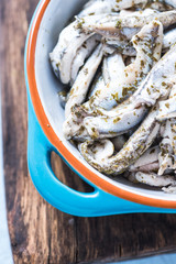 anchovy and herbs in  tapas ceramic bowl